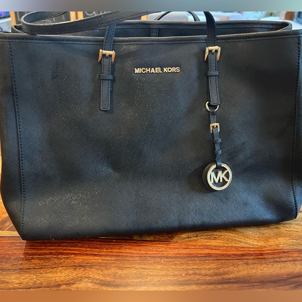 Black hard leather Michael kors handbag. 14 inches wide by 10 inches tall. - Picture 2 of 7